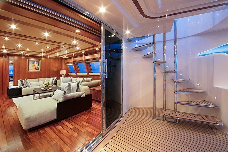 a room with a couch and a table aboard SIMA Yacht for Sale