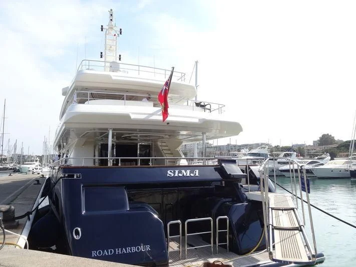 a boat docked at a pier aboard SIMA Yacht for Sale