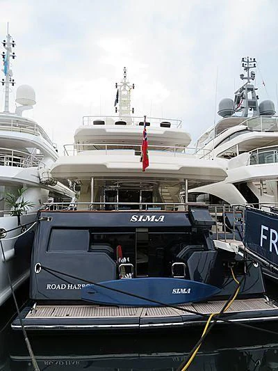 a boat with a flag on the front aboard SIMA Yacht for Sale