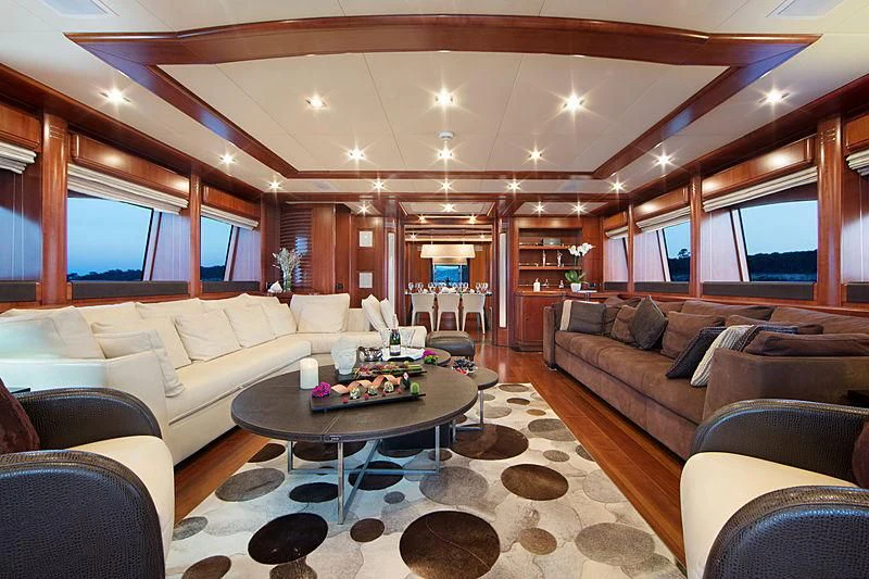 a living room with a large window aboard SIMA Yacht for Sale