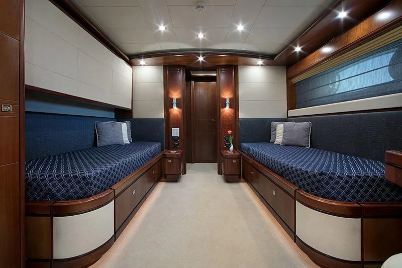 a room with a bed and a couch aboard SIMA Yacht for Sale
