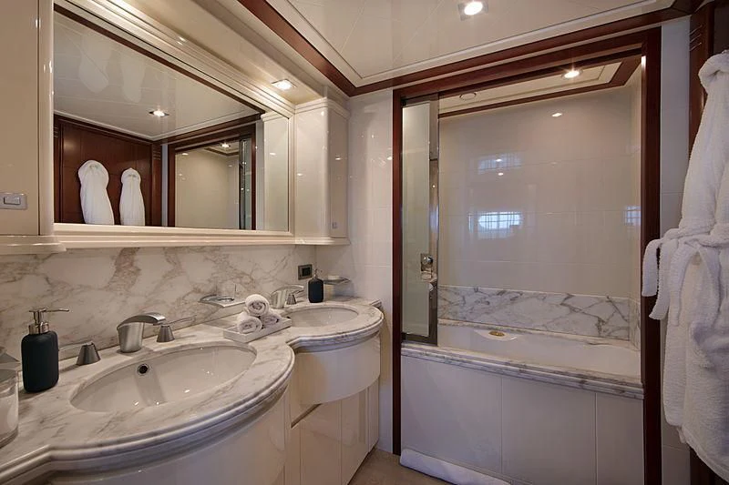 a bathroom with a sink and a bathtub aboard SIMA Yacht for Sale