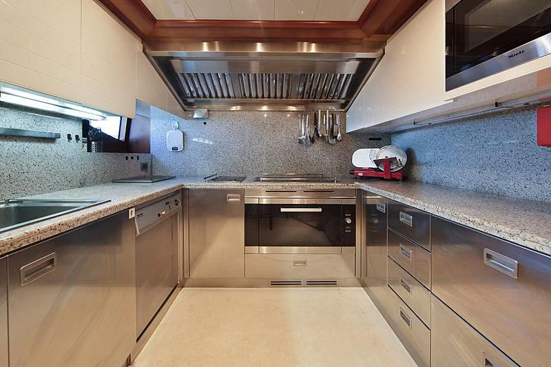 a kitchen with stainless steel appliances aboard SIMA Yacht for Sale