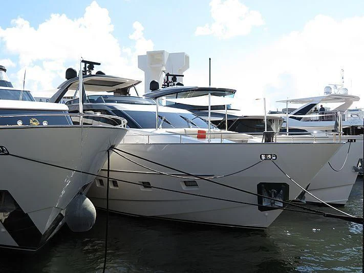 a white yacht on the water aboard RAYEN Yacht for Sale