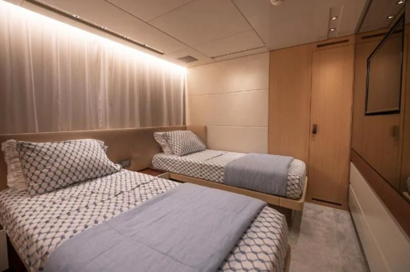 a room with two beds aboard RAYEN Yacht for Sale