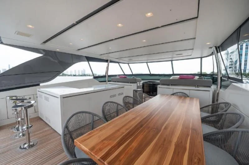 a large room with a table and a large fan aboard RAYEN Yacht for Sale