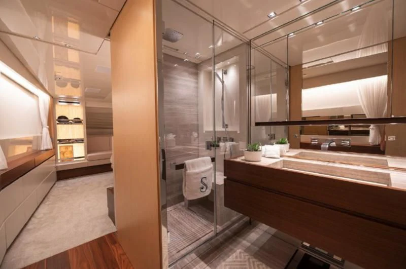 a bathroom with a glass shower aboard RAYEN Yacht for Sale