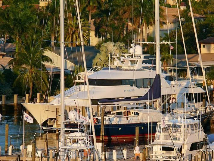 a group of boats are parked in a harbor aboard LIQUID REHAB Yacht for Sale