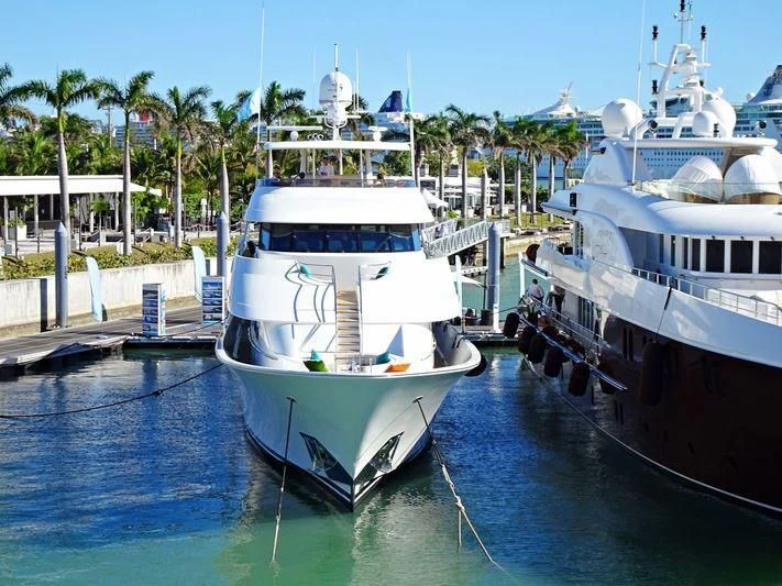 a couple of boats are parked in the water aboard LIQUID REHAB Yacht for Sale