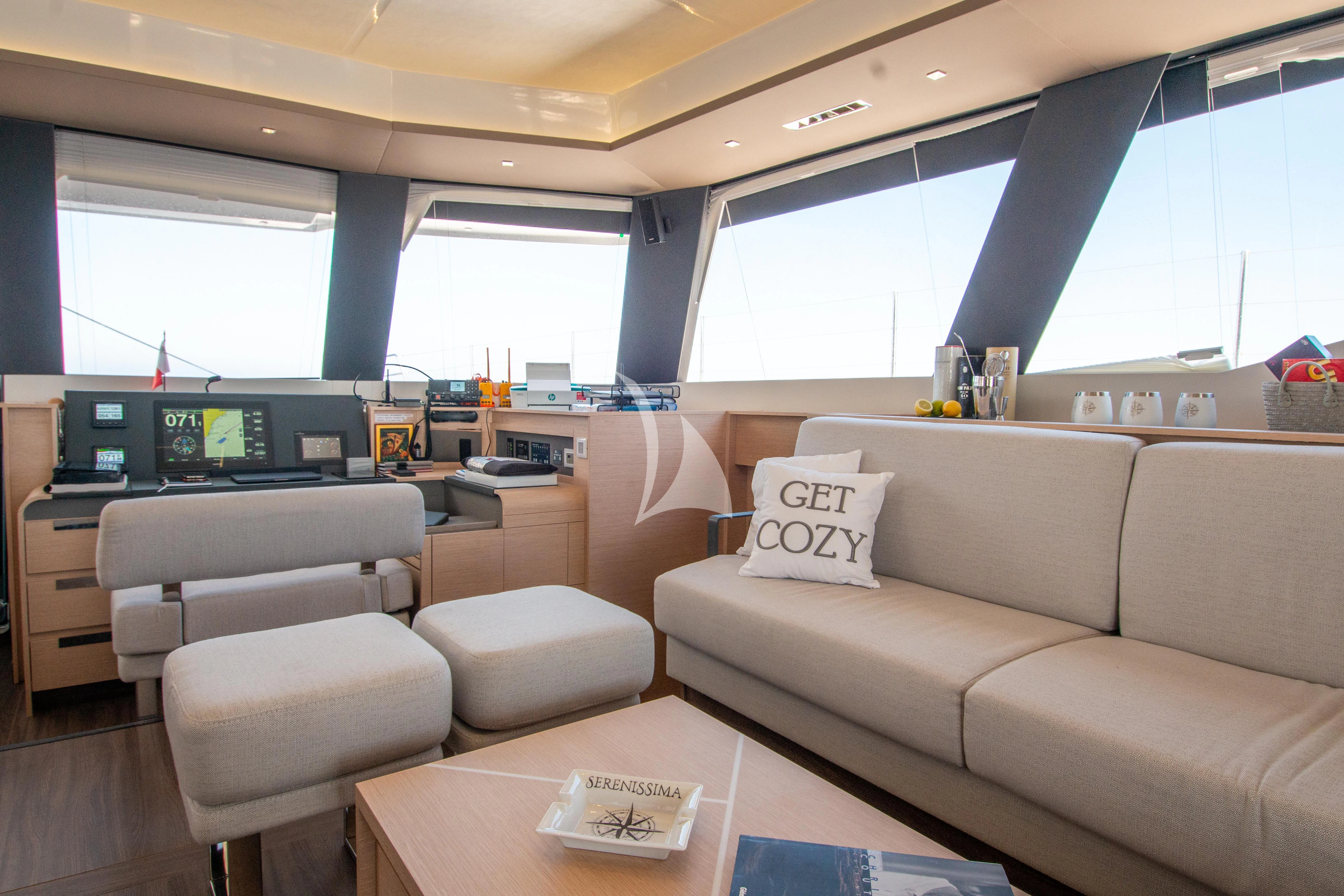 a living room with a couch and a table aboard SERENISSIMA Yacht for Charter