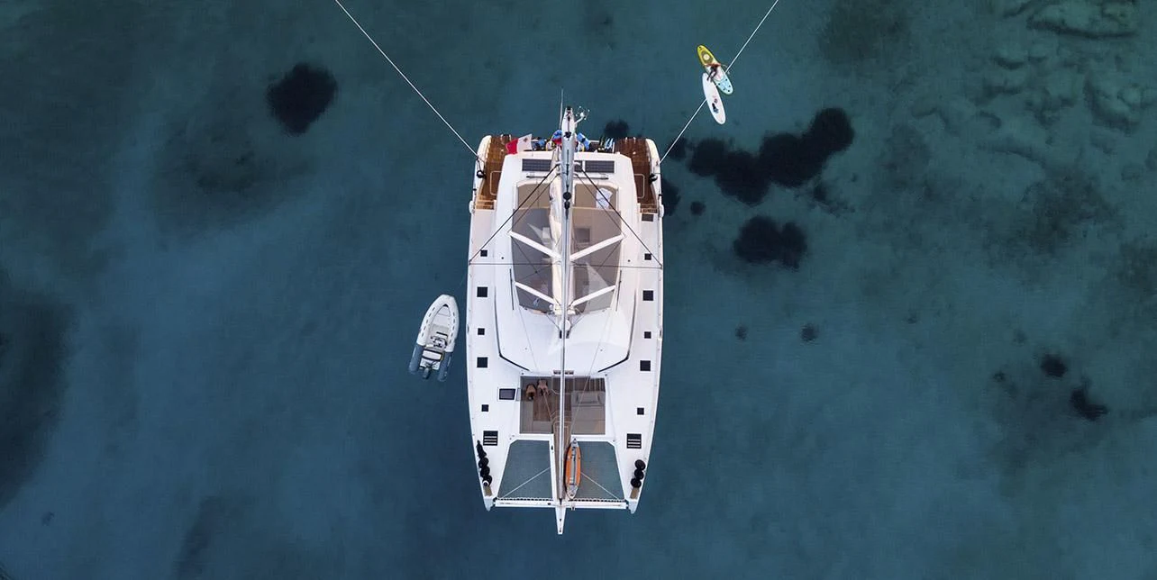 a white ship in the water aboard SERENISSIMA Yacht for Charter