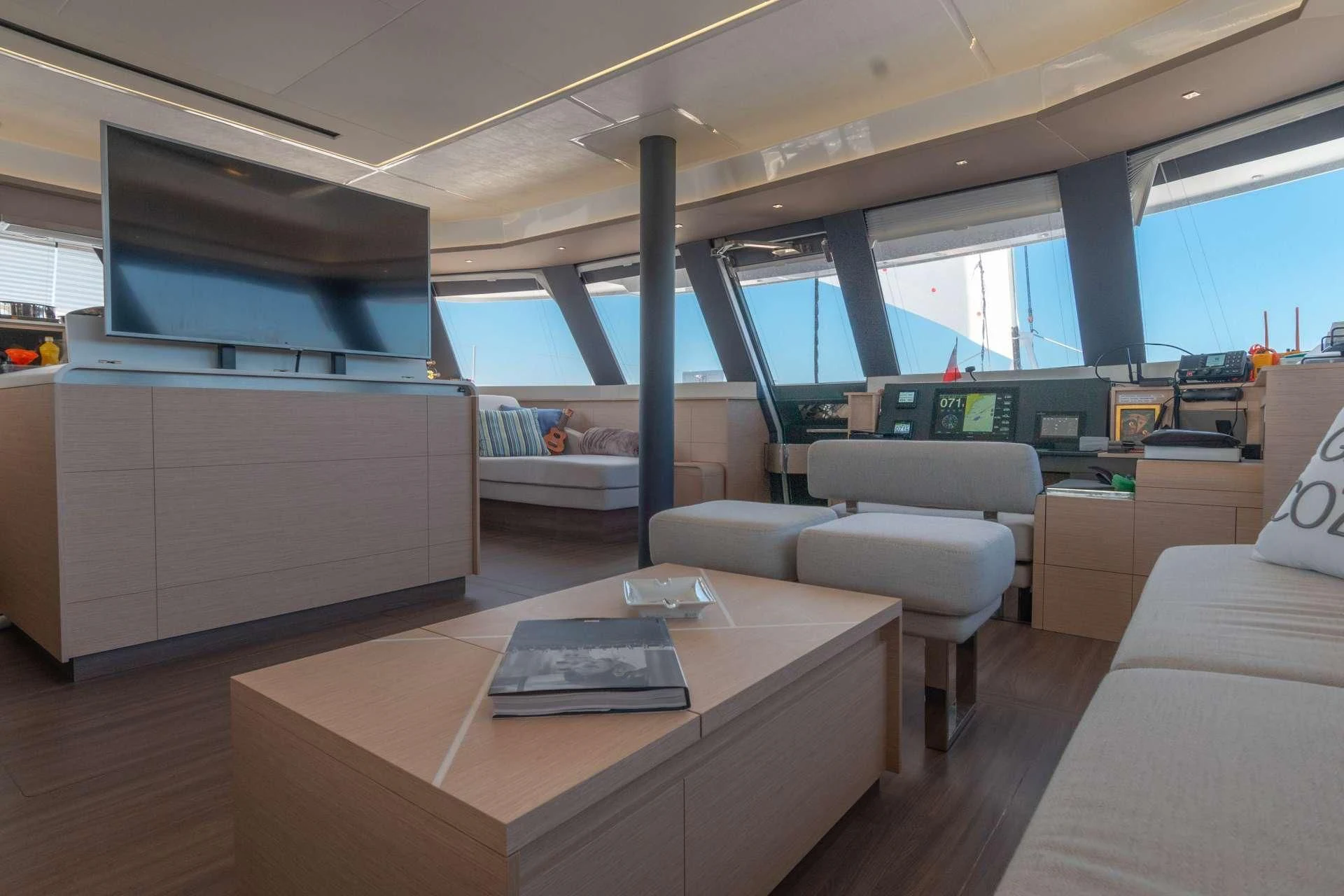 a room with a table and couches aboard SERENISSIMA Yacht for Charter
