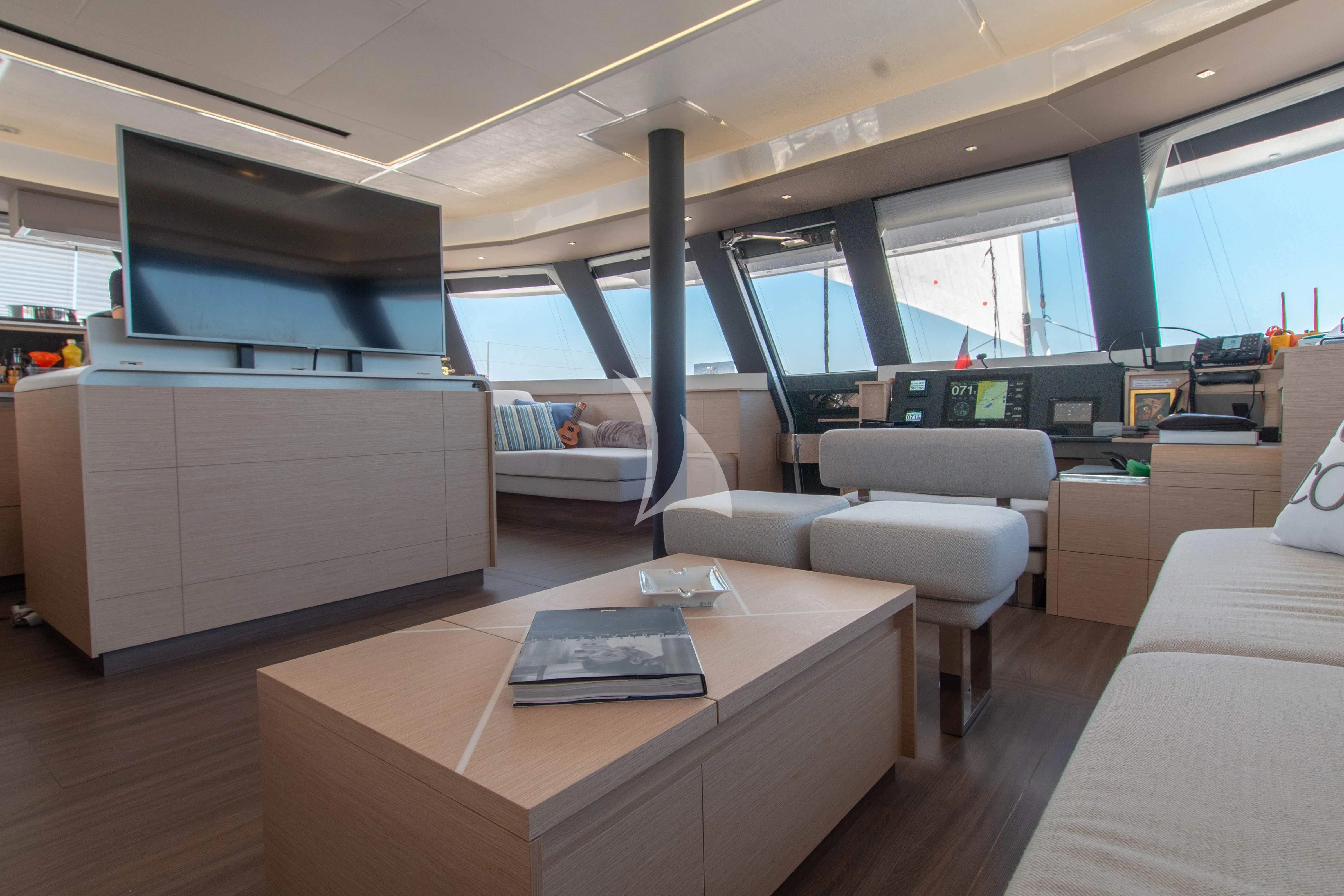 a room with a table and couches aboard SERENISSIMA Yacht for Charter
