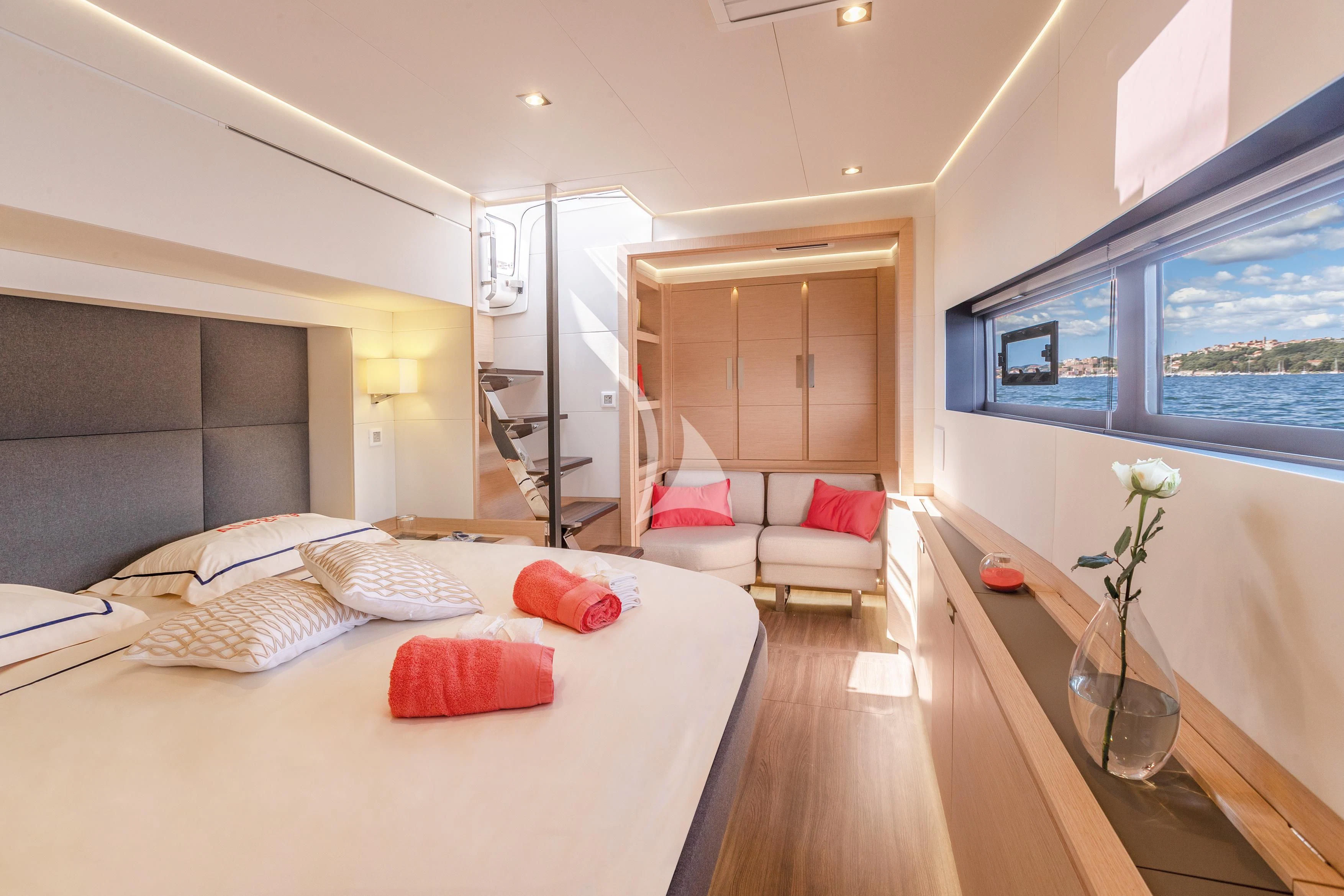 a bedroom with a bed and a desk aboard SERENISSIMA Yacht for Charter