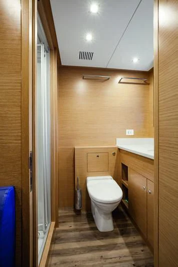 a bathroom with a toilet and a sink aboard SEASENSE Yacht for Sale
