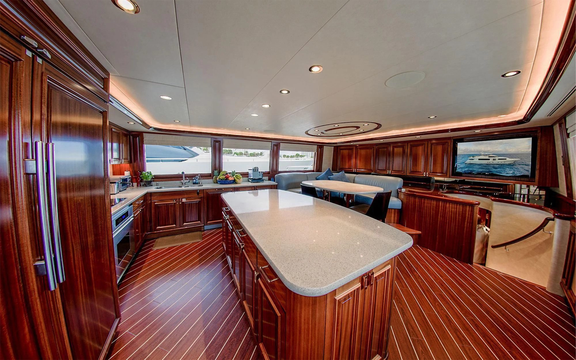 a large kitchen with a bar and bar area aboard SEASENSE Yacht for Sale