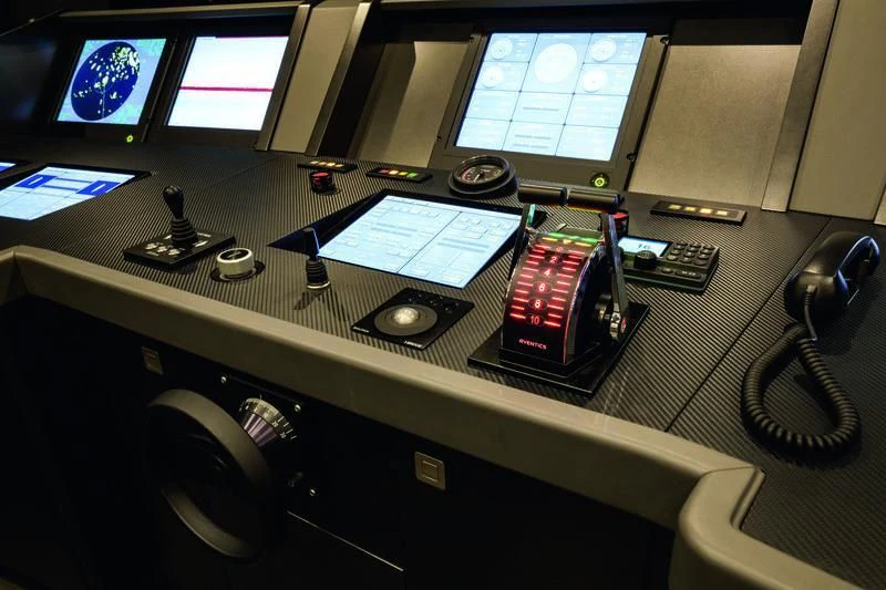a control panel with a computer and other electronic devices aboard SEASENSE Yacht for Sale