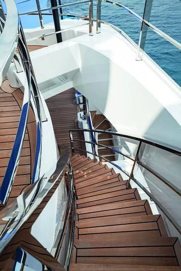 a staircase with a railing aboard SEASENSE Yacht for Sale