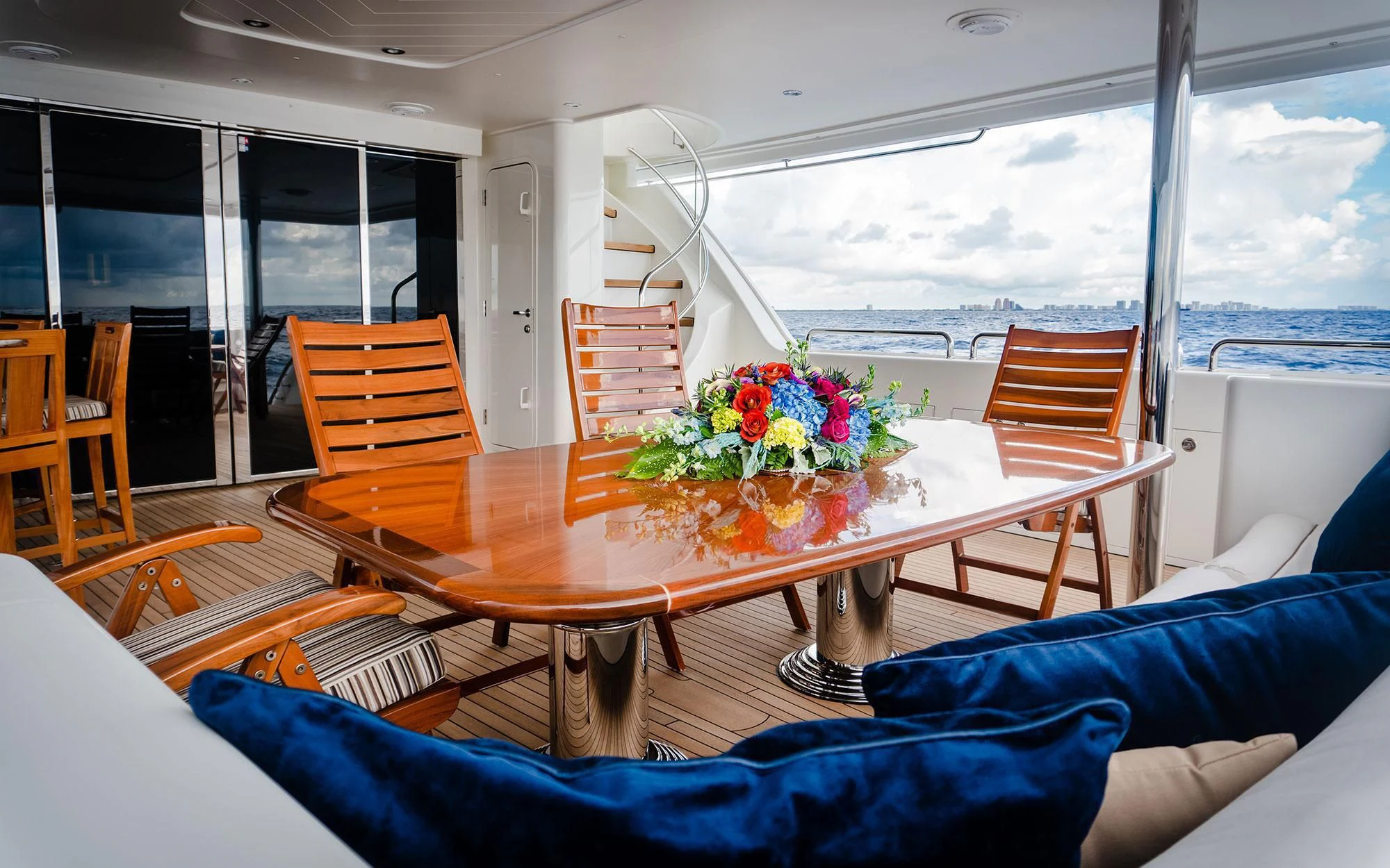 a table with flowers on it aboard SEASENSE Yacht for Sale
