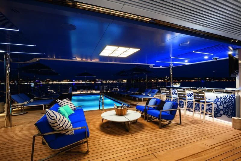 a large room with tables and chairs aboard SEASENSE Yacht for Sale