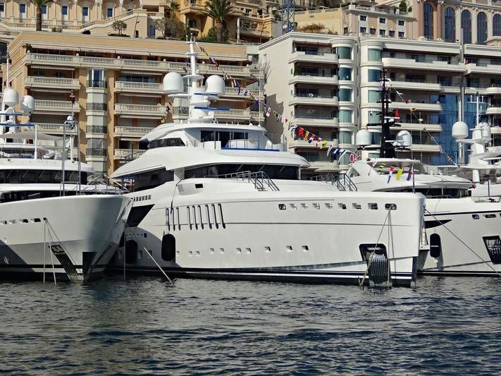 several white yachts in the water aboard SEASENSE Yacht for Sale