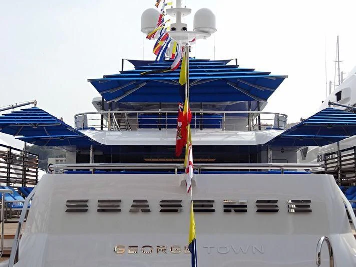 a boat with a flag on it aboard SEASENSE Yacht for Sale