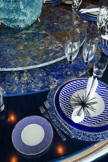 a plate with a spoon and a bowl of food on it aboard SEASENSE Yacht for Sale