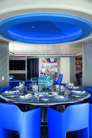 a table with plates and glasses aboard SEASENSE Yacht for Sale