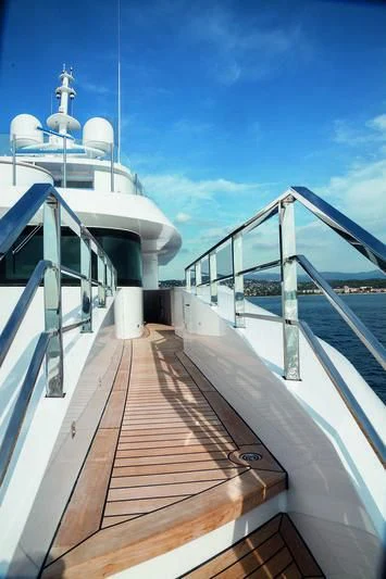 a long wooden walkway aboard SEASENSE Yacht for Sale