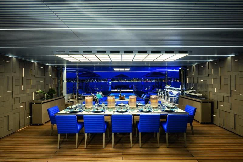 a large room with tables and chairs aboard SEASENSE Yacht for Sale