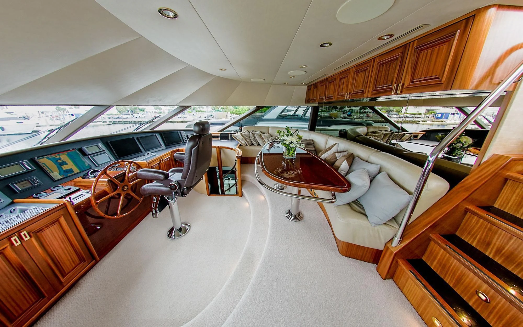 a room with a table and chairs aboard SEASENSE Yacht for Sale