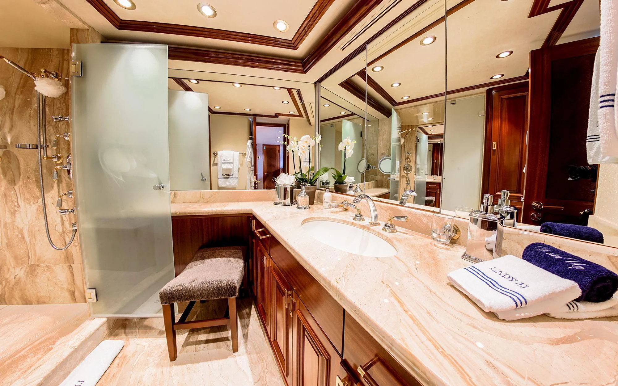 a bathroom with a large mirror aboard SEASENSE Yacht for Sale