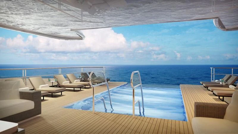 a deck with a large body of water and chairs aboard SEASENSE Yacht for Sale