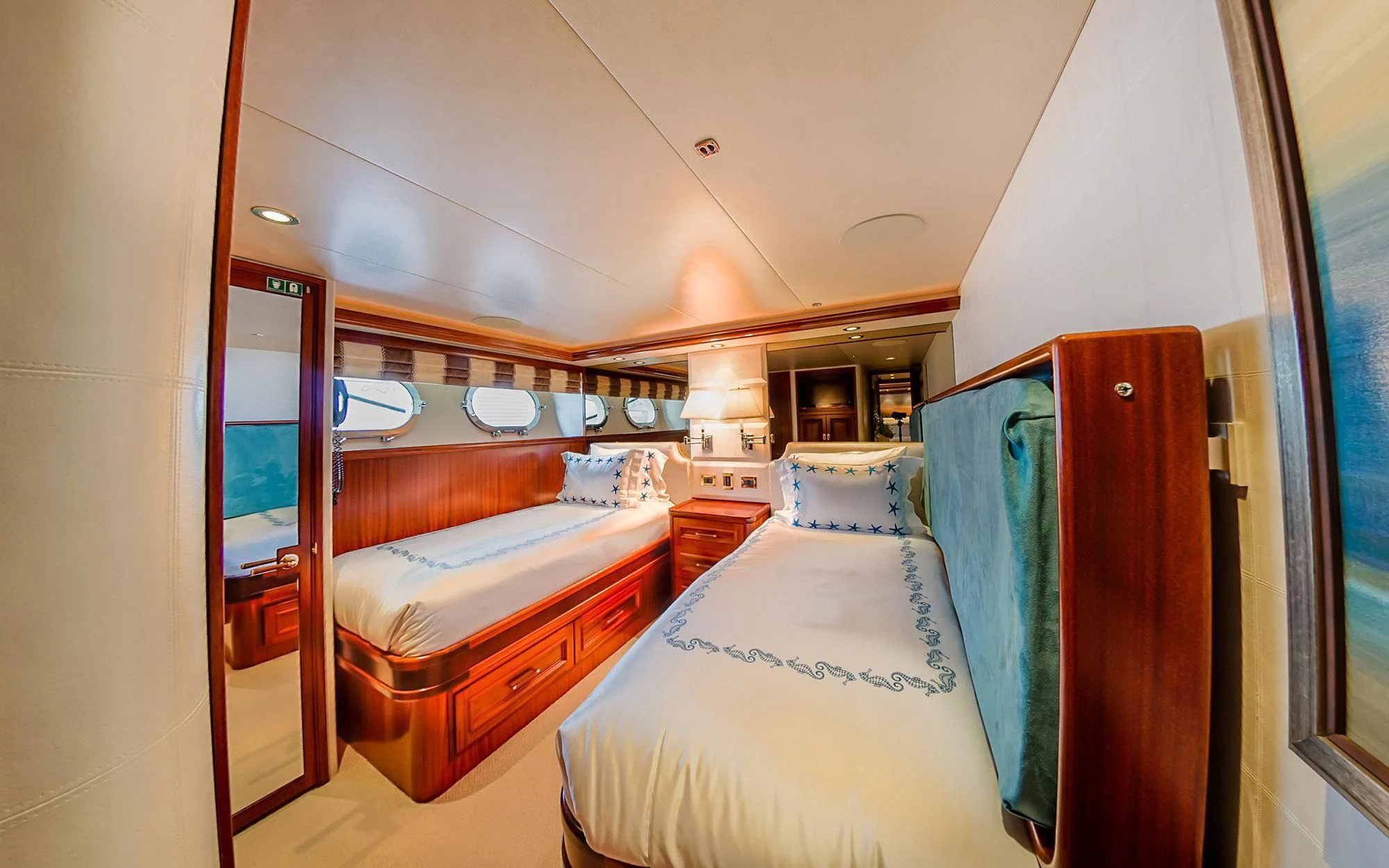 a room with a couple of beds aboard SEASENSE Yacht for Sale