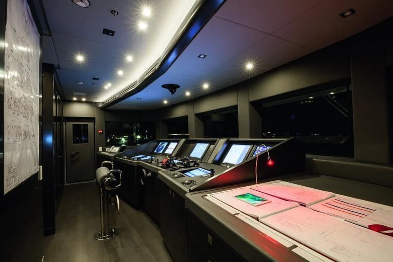 a room with a table and computers aboard SEASENSE Yacht for Sale