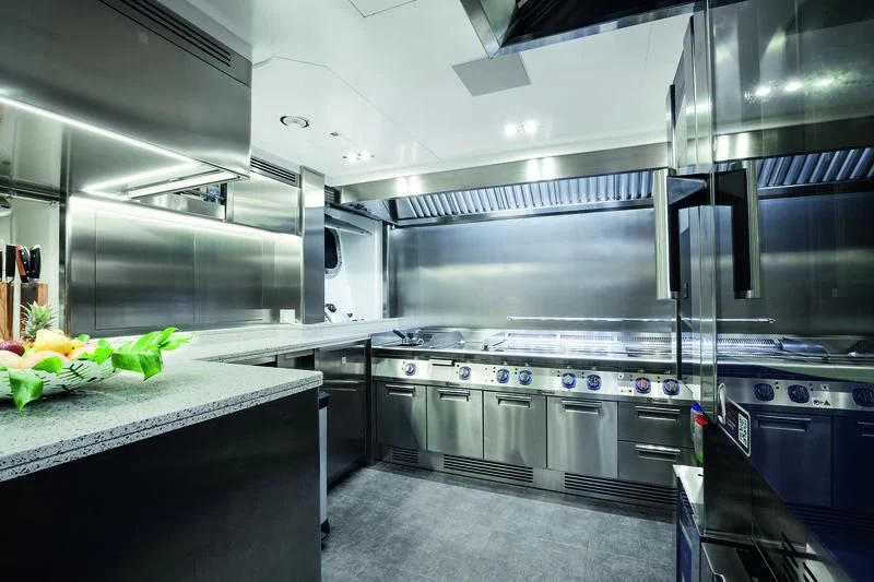 a kitchen with stainless steel appliances aboard SEASENSE Yacht for Sale