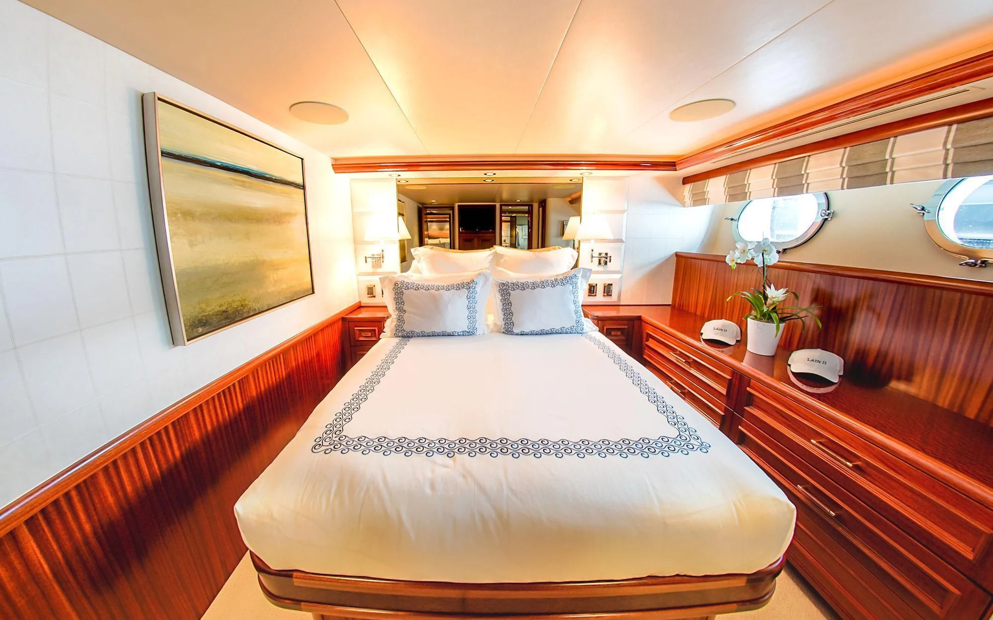 a room with a bed and a desk aboard SEASENSE Yacht for Sale
