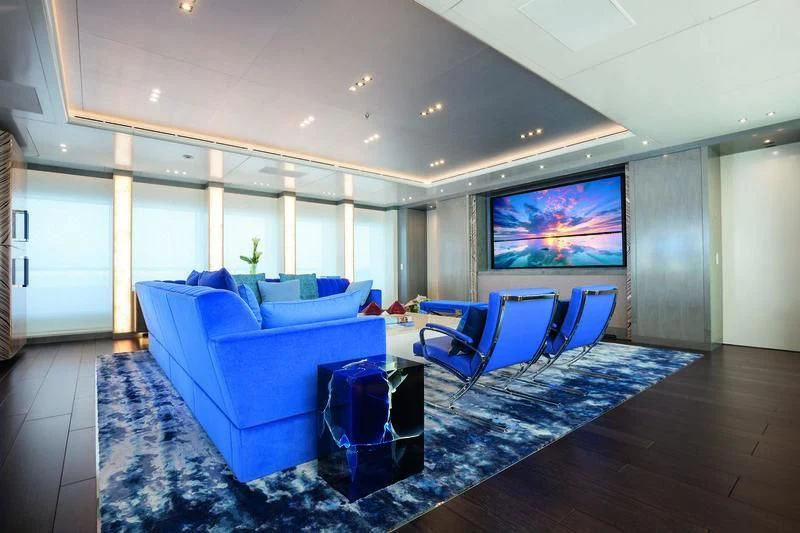 a large room with a couch and a tv aboard SEASENSE Yacht for Sale
