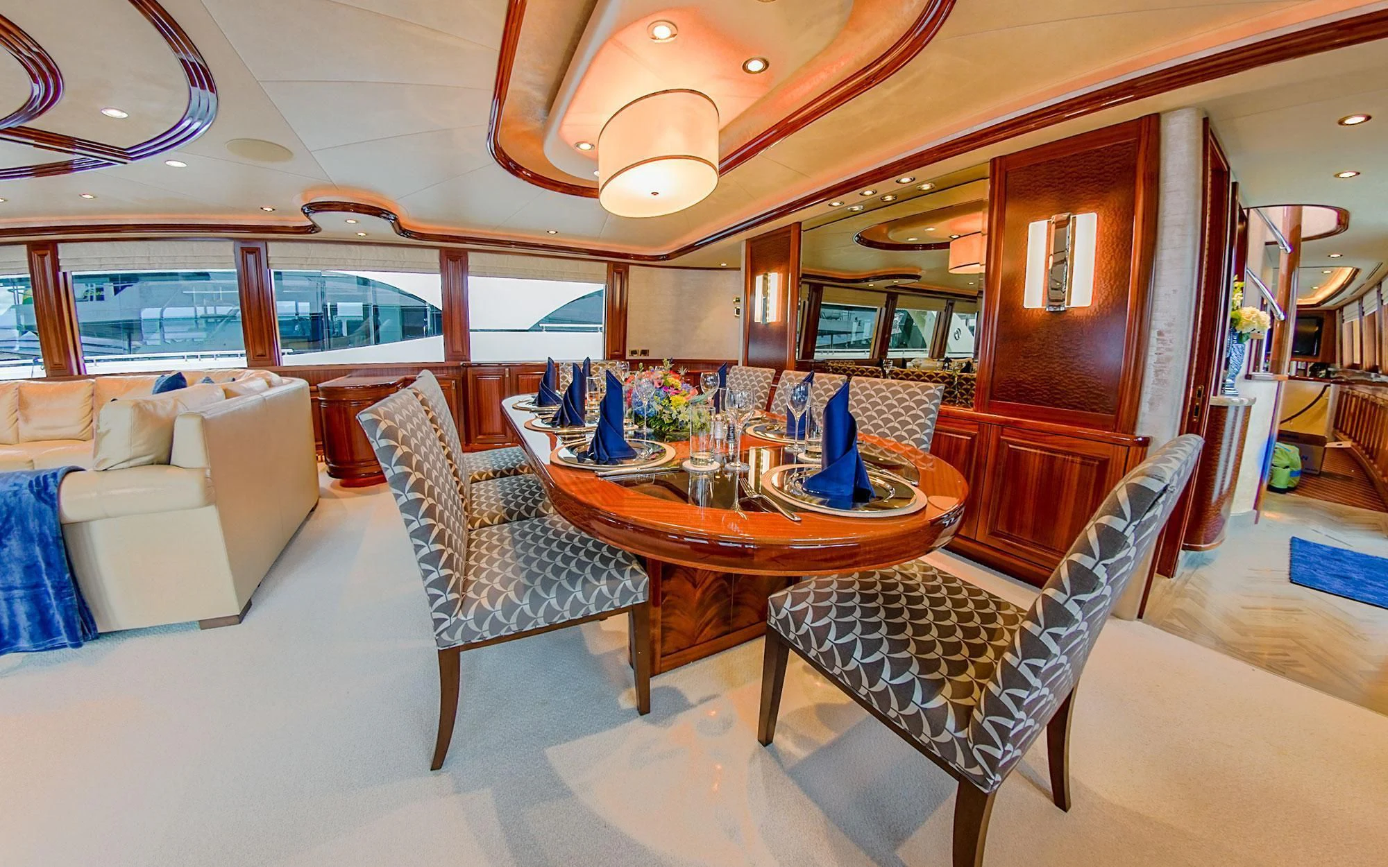 a dining room with a table and chairs aboard SEASENSE Yacht for Sale