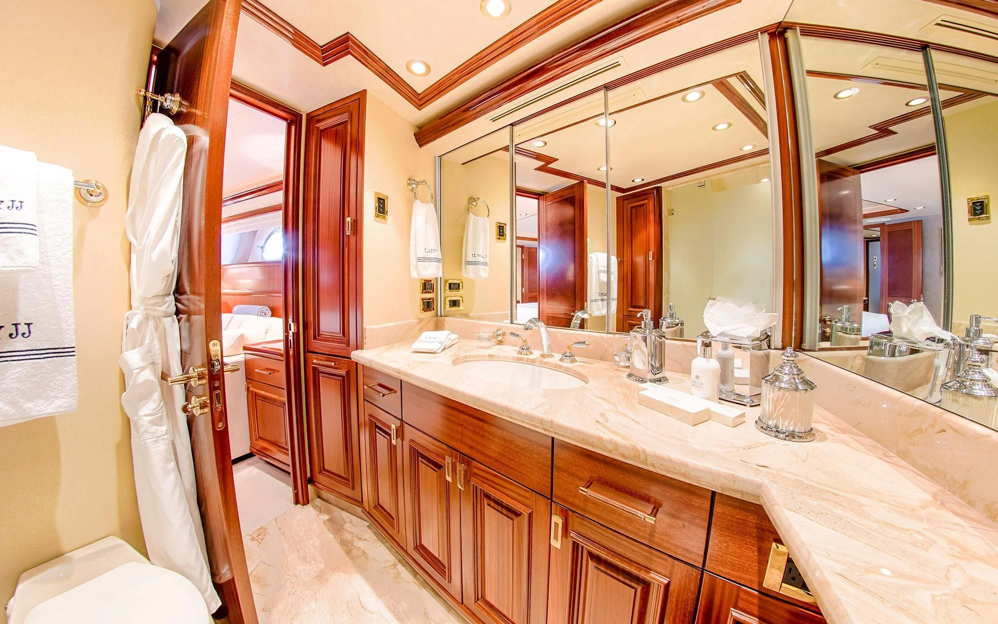 a bathroom with a large mirror aboard SEASENSE Yacht for Sale