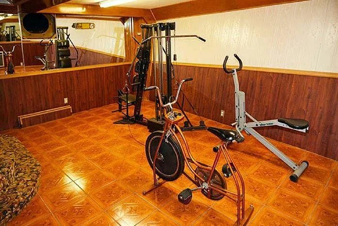 a bicycle in a room aboard ROSE Yacht for Sale