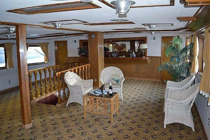 a room with chairs and a table aboard ROSE Yacht for Sale