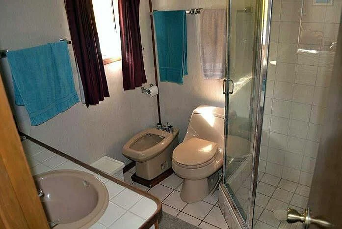 a bathroom with a glass shower aboard ROSE Yacht for Sale