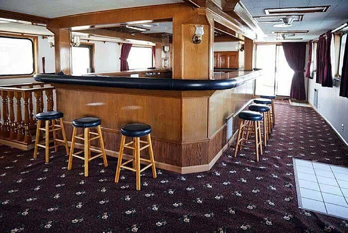 a bar with stools and stools aboard ROSE Yacht for Sale