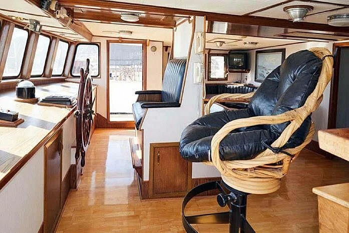 a room with a chair and desk aboard ROSE Yacht for Sale