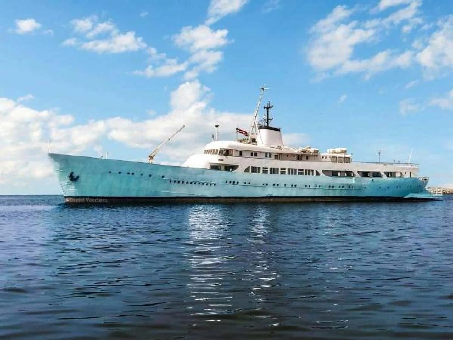 a large ship in the water aboard ROSE Yacht for Sale
