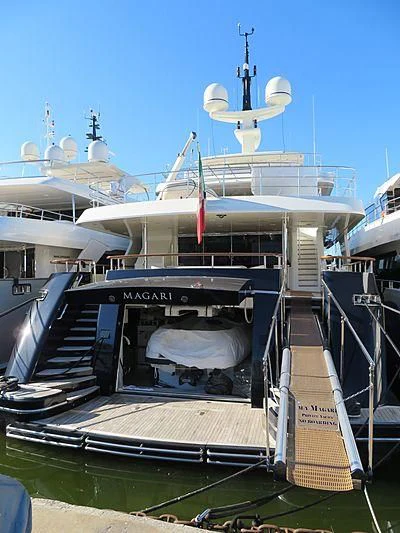 a boat docked at a pier aboard MAGARI Yacht for Sale