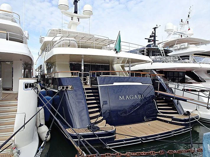 a boat docked at a pier aboard MAGARI Yacht for Sale