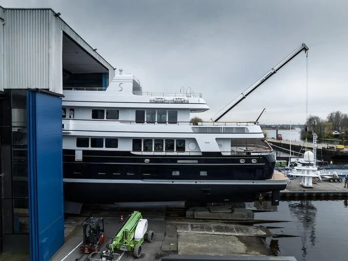 a boat docked at a pier aboard MOONSHADOW Yacht for Sale