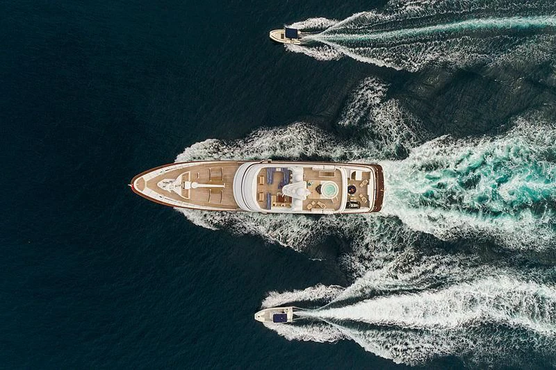 a bottle on a beach aboard MOONSHADOW Yacht for Sale
